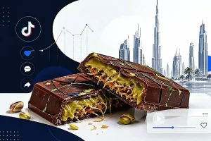 Przełamana tabliczka czekolady z pistacjowym nadzieniem i chrupiącym kataifi, symbolizująca viralowy trend czekolady z Dubaju.